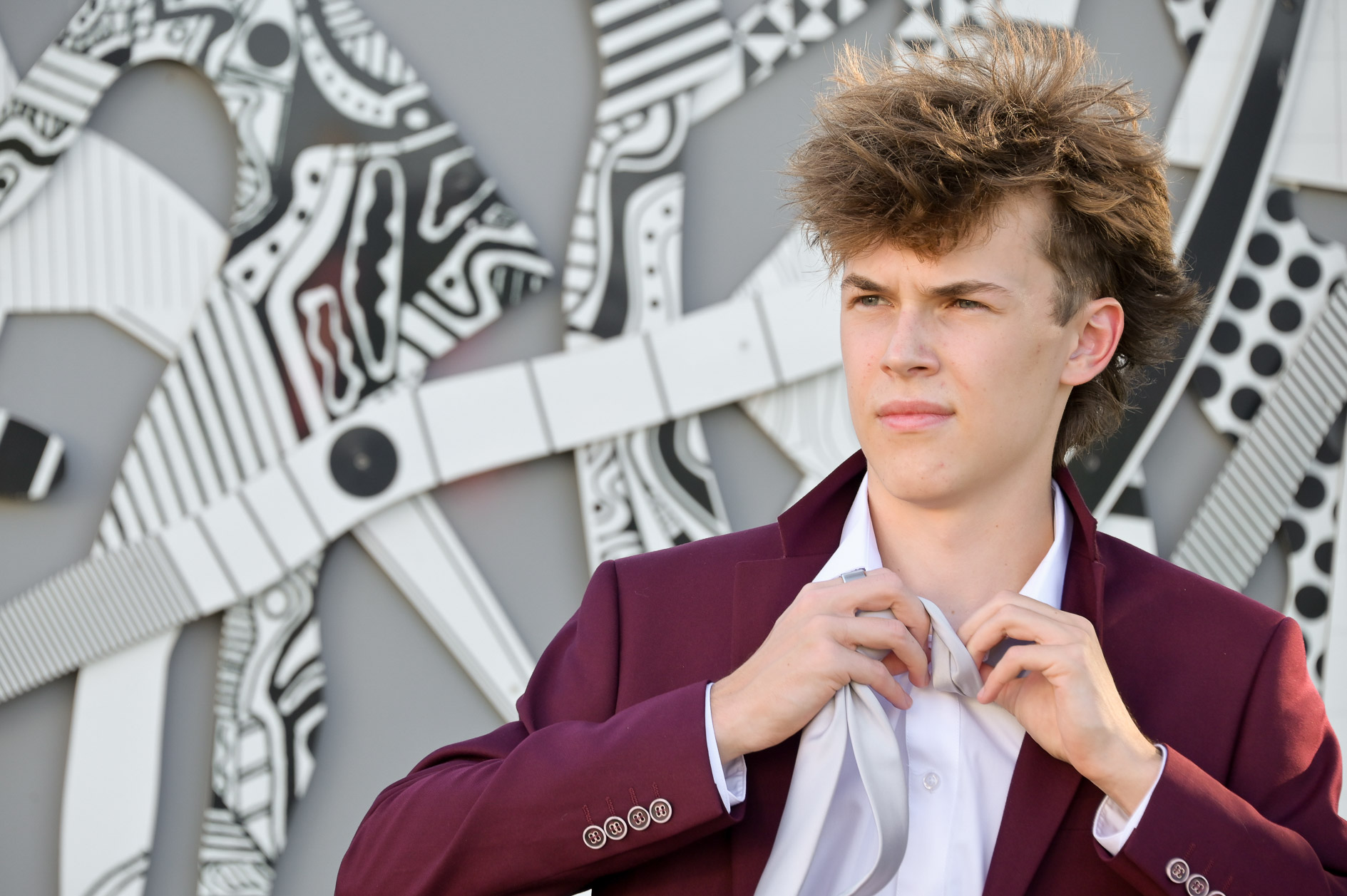 Starting to change his outfit in front a wall mural in Detroit, Michigan, Adam even made this task photo worthy.