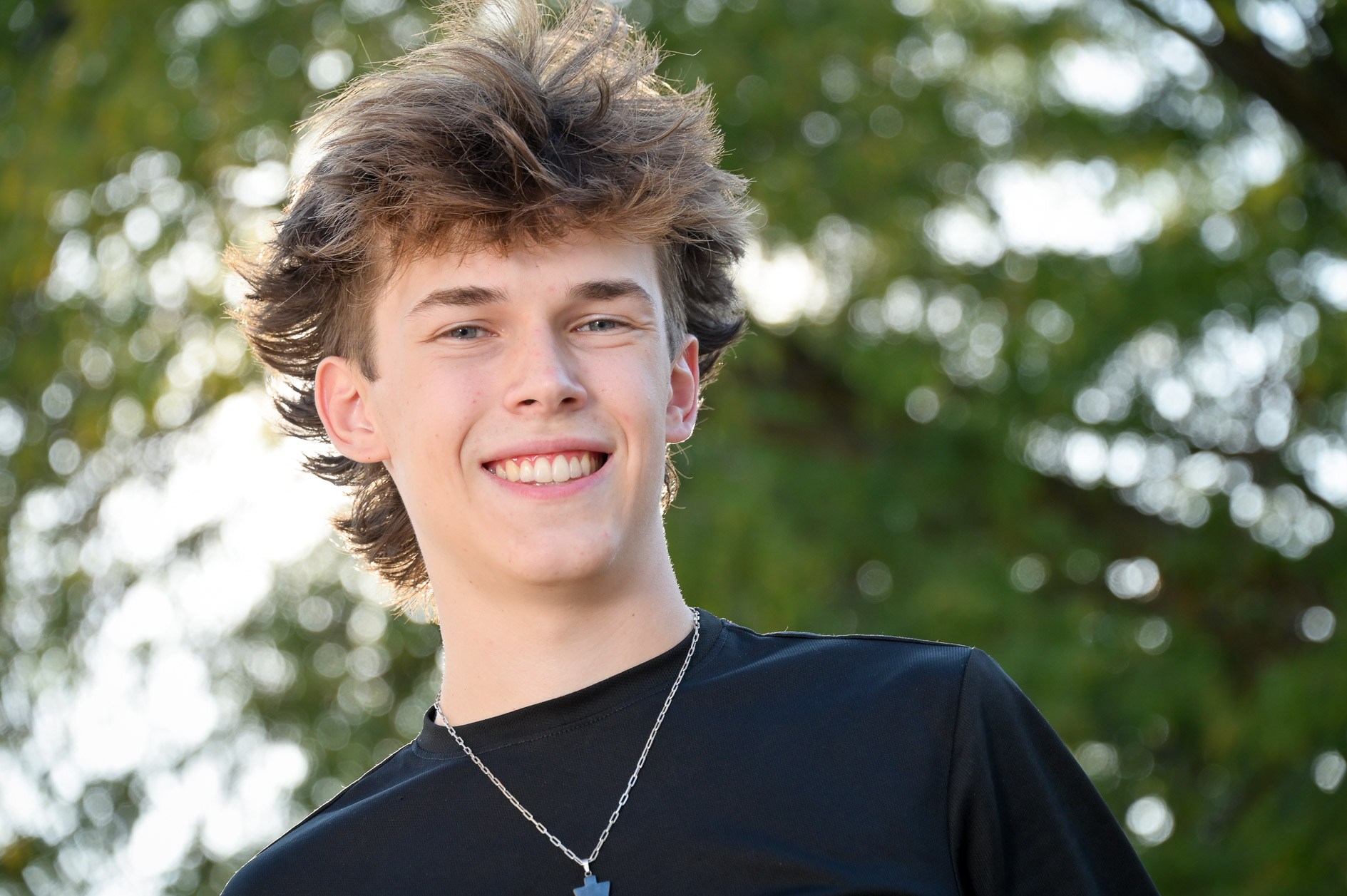 Getting a traditional senior photo is something I always do, like this happy, smiling photo of a Royal Oak senior.