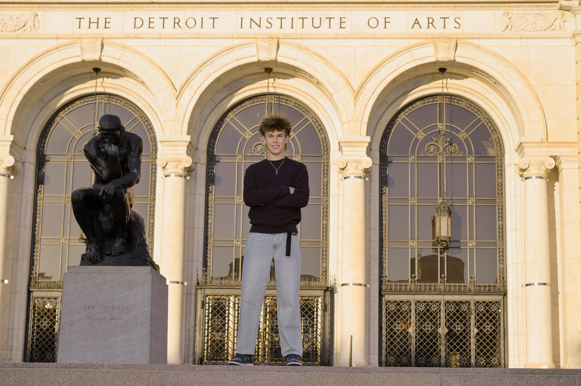 As the sun sets, Adam posed in front of the Detroit Institute of Art in Detroit.