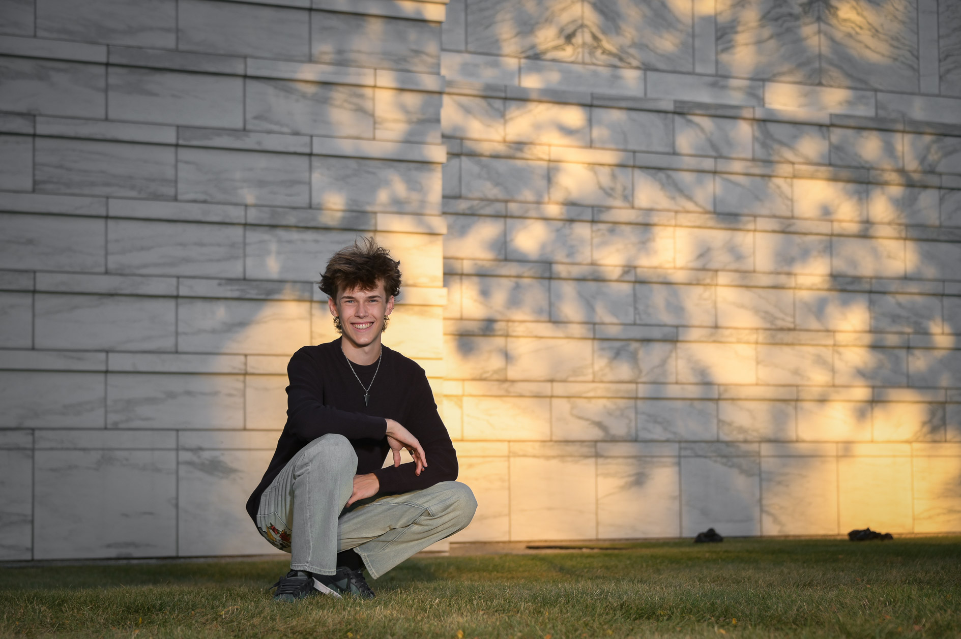 Using light and shadows for creative, artist senior photographs.