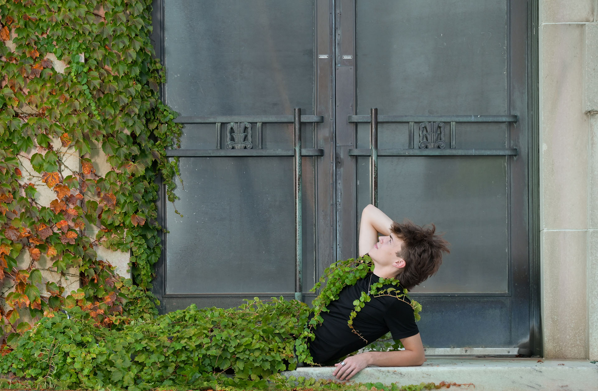 Adam stretches out like a Greek God amongst vines in Detroit for this epic senior portrait..