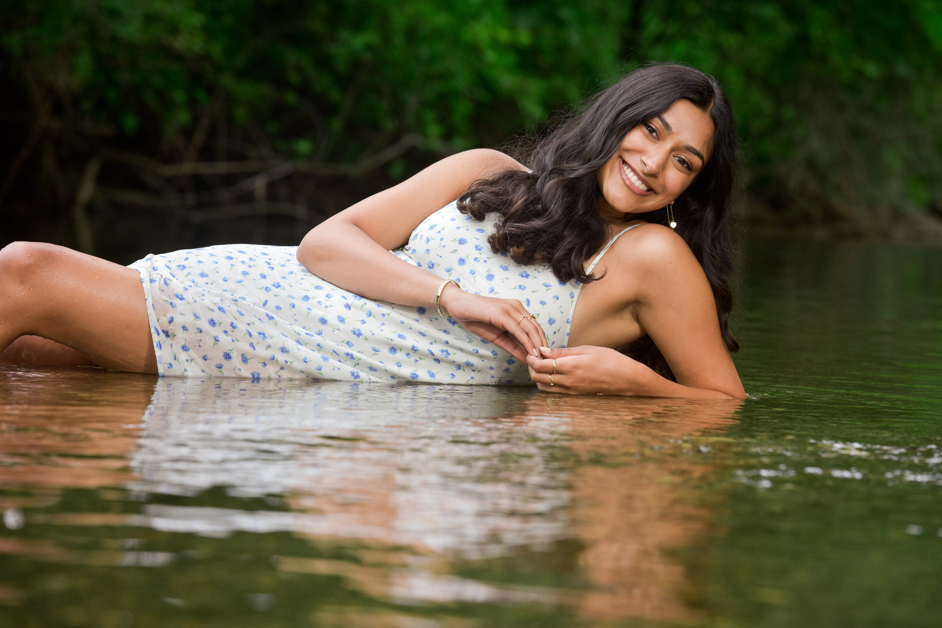 Rochester High swimmer senior makes herself comfortable as she lays down in the water near Rochester, MI. 