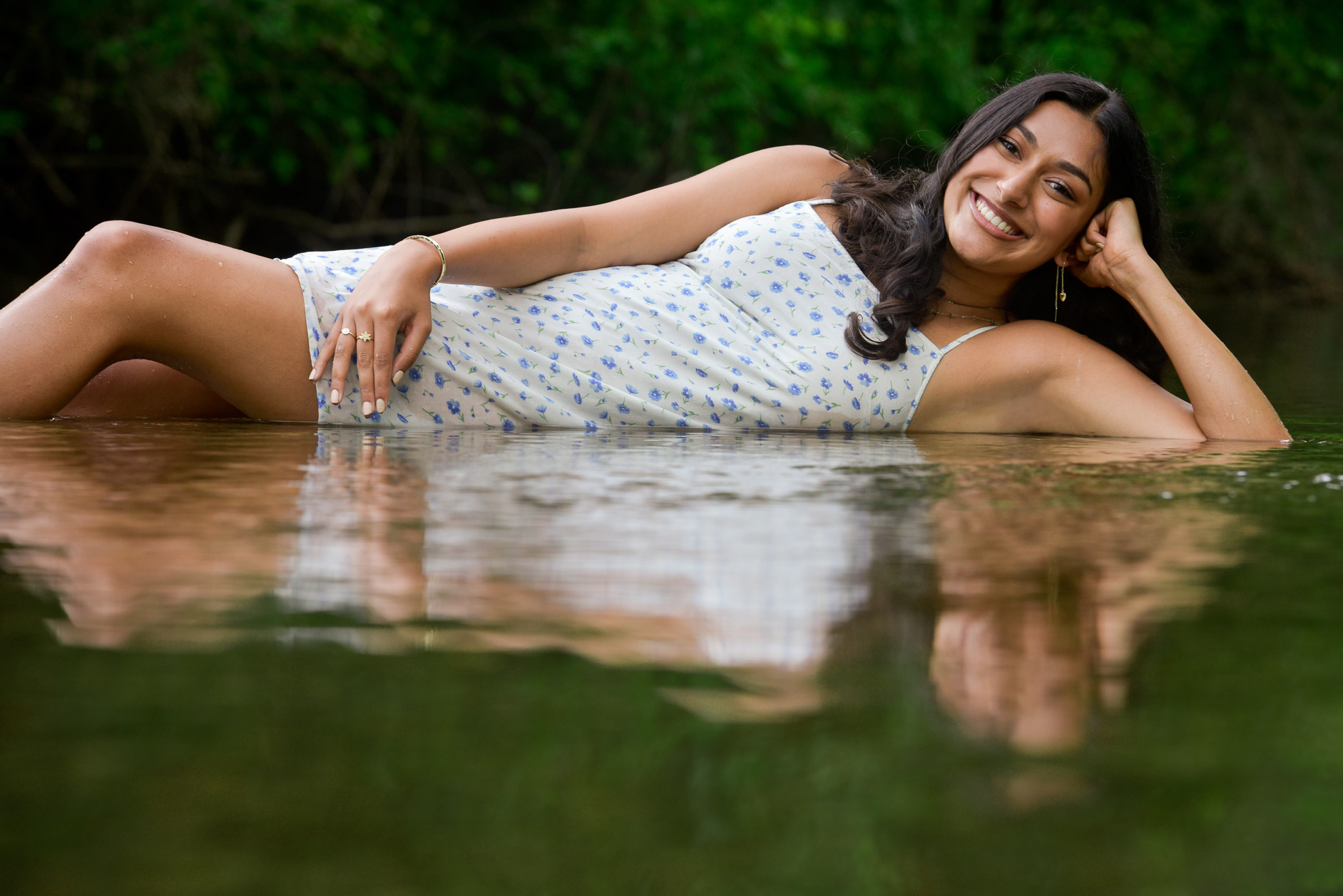 Rochester High swimmer senior makes herself comfortable as she lays down in the water near Rochester, MI. 
