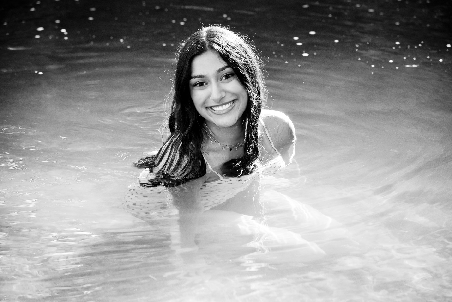 Rochester High swimmer senior submerges herself totally in water near Rochester, MI for these cool swimmer senior pictures. 