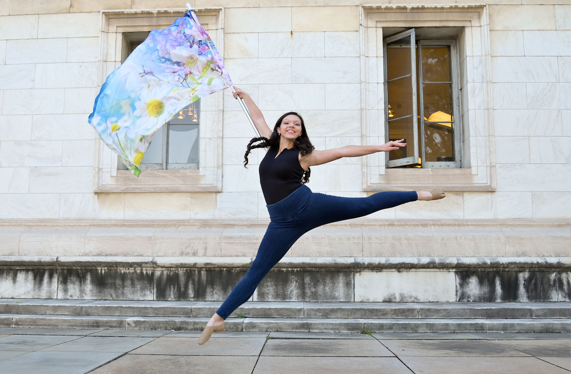 Olivia dancing her Color Guard routine  at Troy High School in Troy, Michigan for her senior photos.